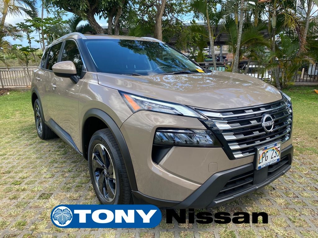 2024 Nissan Rogue SV in Baja Storm Metallic — front three-quarter view